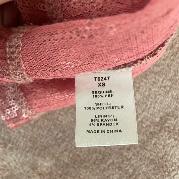 Shiny babydoll shirt. Stunning with a pair of heels and jeans. - Picture 9 of 15